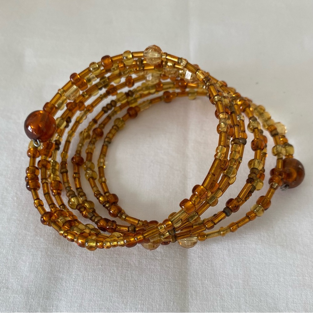 Vintage Coil Stacked bracelet Amber and Gold beads and Crystals